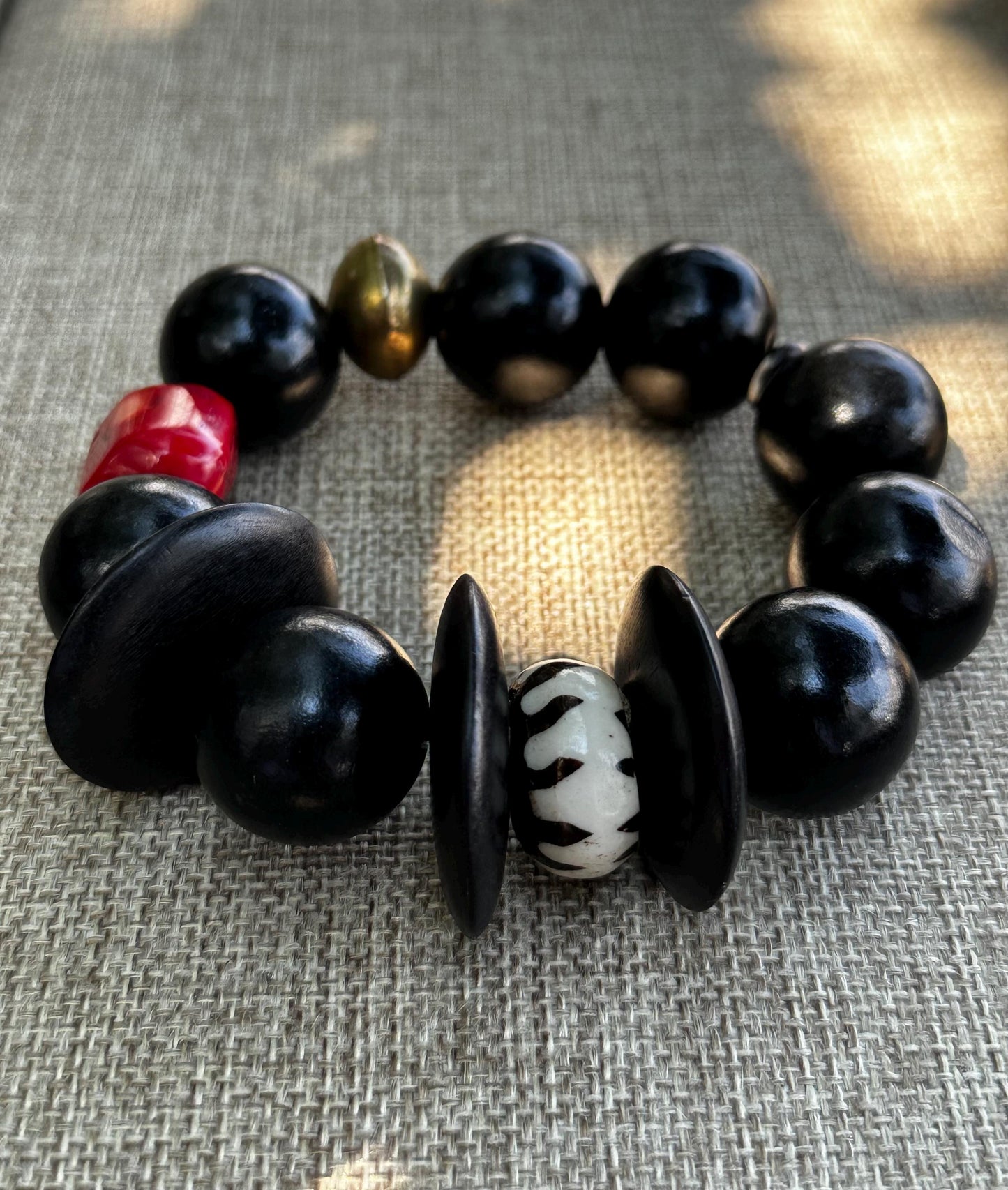 Handmade Black Wood Bead Bracelet: Red Coral & Kenyan Bone Statement