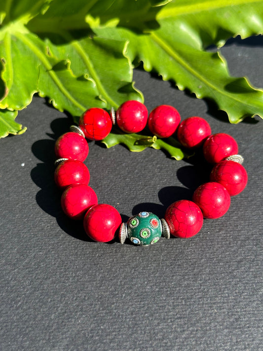 Red Beaded Bracelet with Green Focal Bead