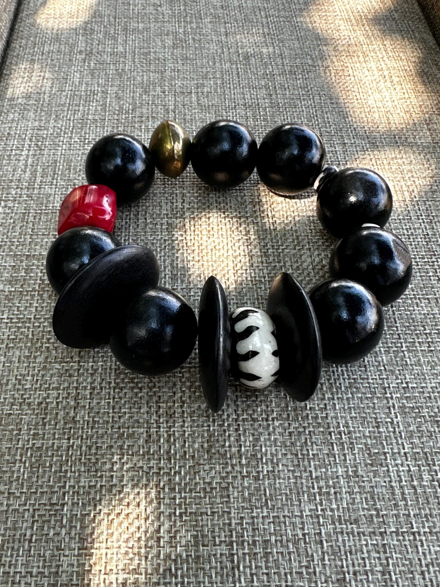 Handmade Black Wood Bead Bracelet: Red Coral & Kenyan Bone Statement